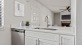 a kitchen with white cabinets